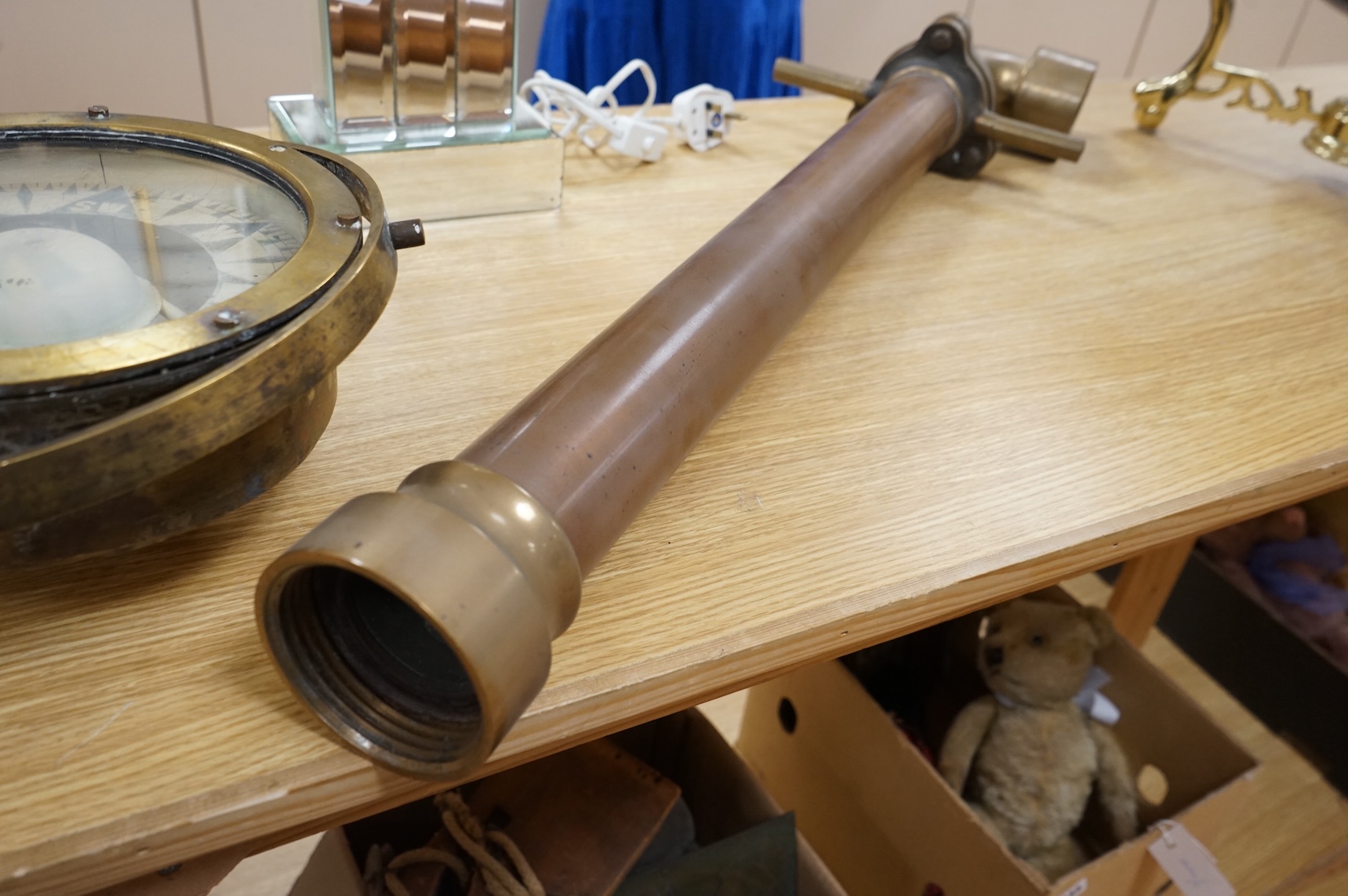 A brass ship's compass in gimbal and a copper water hydrant, 95.5cm